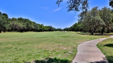 Welcome home to Showhouse Perfection in this beautifully on Halifax Plantation Golf Club in Florida - for sale on GolfHomes.com, golf home, golf lot