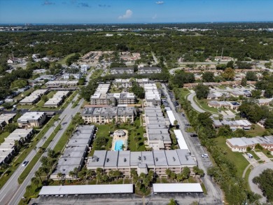 EASY FLORIDA LIVING AWAITS in this TOP FLOOR CONDO located in on Bayou Golf Club in Florida - for sale on GolfHomes.com, golf home, golf lot