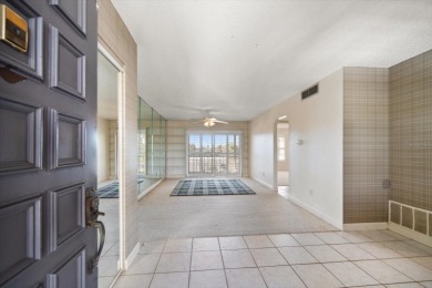 EASY FLORIDA LIVING AWAITS in this TOP FLOOR CONDO located in on Bayou Golf Club in Florida - for sale on GolfHomes.com, golf home, golf lot