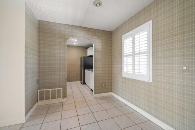 EASY FLORIDA LIVING AWAITS in this TOP FLOOR CONDO located in on Bayou Golf Club in Florida - for sale on GolfHomes.com, golf home, golf lot