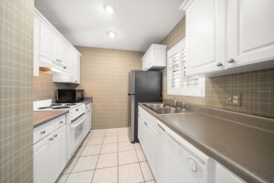 EASY FLORIDA LIVING AWAITS in this TOP FLOOR CONDO located in on Bayou Golf Club in Florida - for sale on GolfHomes.com, golf home, golf lot