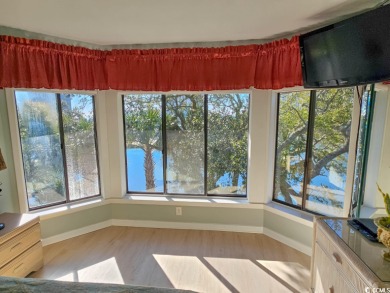 What a BEAUTIFUL view of the lake and ocean from this screened on Arcadian Shores Golf Club in South Carolina - for sale on GolfHomes.com, golf home, golf lot