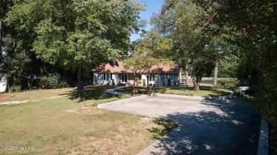 Located on the 18th green at Wilson Country Club, this beautiful on Wilson Country Club in North Carolina - for sale on GolfHomes.com, golf home, golf lot