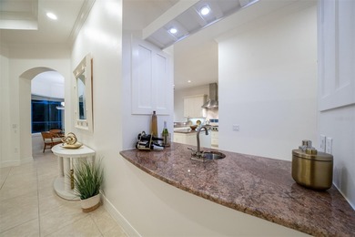 Low-maintenance, country club home with a private setting! Over on Boca Royale Golf and Country Club in Florida - for sale on GolfHomes.com, golf home, golf lot