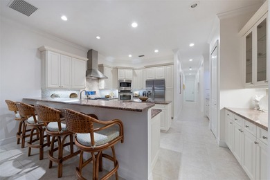 Low-maintenance, country club home with a private setting! Over on Boca Royale Golf and Country Club in Florida - for sale on GolfHomes.com, golf home, golf lot