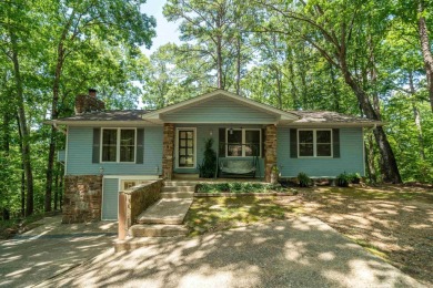 Nestled in a peaceful, wooded setting of Diamondhead Golf & on Diamondhead Golf and Country Club in Arkansas - for sale on GolfHomes.com, golf home, golf lot