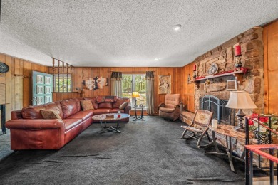 Nestled in a peaceful, wooded setting of Diamondhead Golf & on Diamondhead Golf and Country Club in Arkansas - for sale on GolfHomes.com, golf home, golf lot