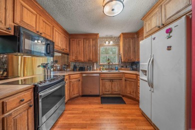 Nestled in a peaceful, wooded setting of Diamondhead Golf & on Diamondhead Golf and Country Club in Arkansas - for sale on GolfHomes.com, golf home, golf lot