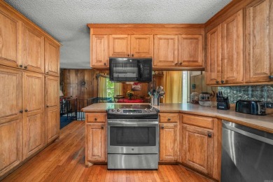 Nestled in a peaceful, wooded setting of Diamondhead Golf & on Diamondhead Golf and Country Club in Arkansas - for sale on GolfHomes.com, golf home, golf lot