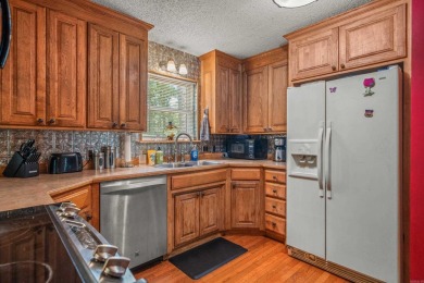 Nestled in a peaceful, wooded setting of Diamondhead Golf & on Diamondhead Golf and Country Club in Arkansas - for sale on GolfHomes.com, golf home, golf lot