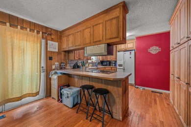 Nestled in a peaceful, wooded setting of Diamondhead Golf & on Diamondhead Golf and Country Club in Arkansas - for sale on GolfHomes.com, golf home, golf lot