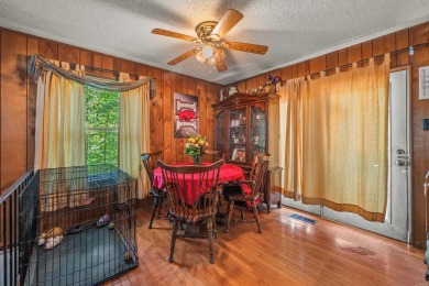 Nestled in a peaceful, wooded setting of Diamondhead Golf & on Diamondhead Golf and Country Club in Arkansas - for sale on GolfHomes.com, golf home, golf lot