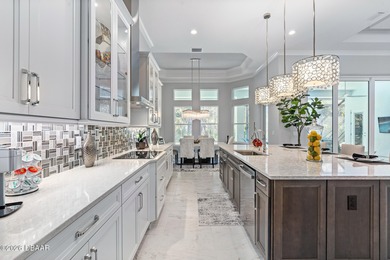 Experience luxury living at its finest in this exceptional 2023 on Plantation Bay Golf and Country Club in Florida - for sale on GolfHomes.com, golf home, golf lot