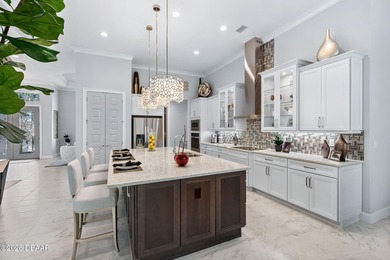 Experience luxury living at its finest in this exceptional 2023 on Plantation Bay Golf and Country Club in Florida - for sale on GolfHomes.com, golf home, golf lot