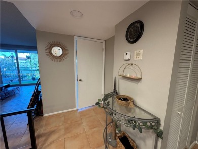 UPDATED 3rd Floor 1 bedroom/1.5 bath condo in International on Inverrary Country Club in Florida - for sale on GolfHomes.com, golf home, golf lot