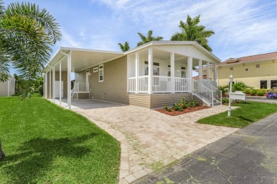 This 2024 Jacobsen Home offering two bedrooms, plus a den, is on Royal Wood Golf and Country Club in Florida - for sale on GolfHomes.com, golf home, golf lot