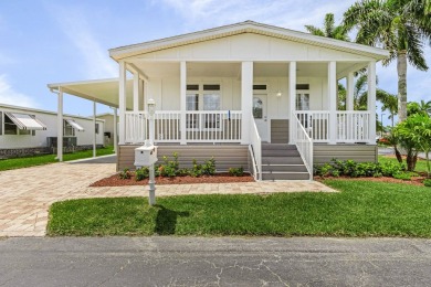 This 2024 Jacobsen Home offering two bedrooms, plus a den, is on Royal Wood Golf and Country Club in Florida - for sale on GolfHomes.com, golf home, golf lot