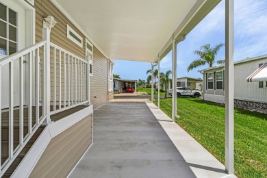 This 2024 Jacobsen Home offering two bedrooms, plus a den, is on Royal Wood Golf and Country Club in Florida - for sale on GolfHomes.com, golf home, golf lot