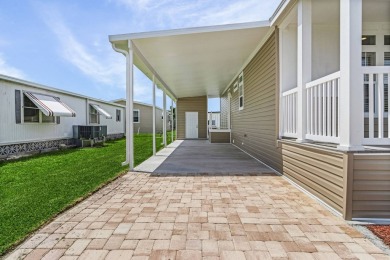 This 2024 Jacobsen Home offering two bedrooms, plus a den, is on Royal Wood Golf and Country Club in Florida - for sale on GolfHomes.com, golf home, golf lot