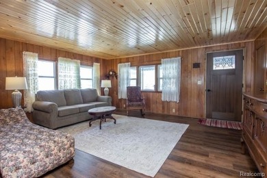 Welcome to your Up North getaway or your year round home inside on Lost Lake Woods Club in Michigan - for sale on GolfHomes.com, golf home, golf lot