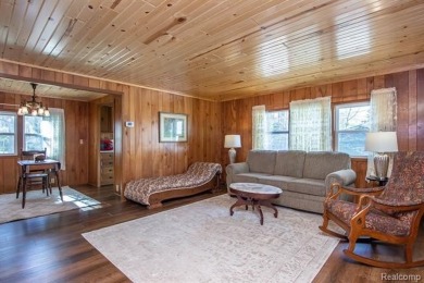 Welcome to your Up North getaway or your year round home inside on Lost Lake Woods Club in Michigan - for sale on GolfHomes.com, golf home, golf lot