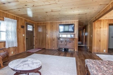 Welcome to your Up North getaway or your year round home inside on Lost Lake Woods Club in Michigan - for sale on GolfHomes.com, golf home, golf lot