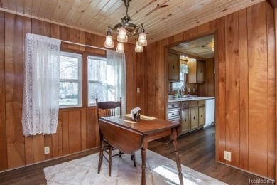 Welcome to your Up North getaway or your year round home inside on Lost Lake Woods Club in Michigan - for sale on GolfHomes.com, golf home, golf lot