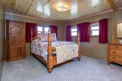 Welcome to your Up North getaway or your year round home inside on Lost Lake Woods Club in Michigan - for sale on GolfHomes.com, golf home, golf lot