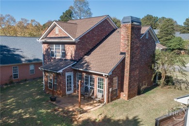 Charming and low-maintenance, this all-brick two-story home is on Jennings Mill Country Club in Georgia - for sale on GolfHomes.com, golf home, golf lot