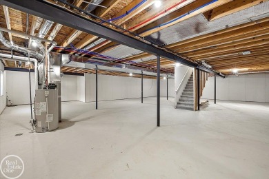 Quality luxury ranch featuring a modern and stylish design built on Copper Hills Golf and Country Club in Michigan - for sale on GolfHomes.com, golf home, golf lot