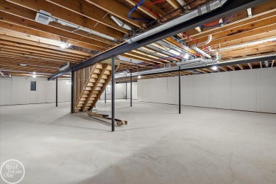 Quality luxury ranch featuring a modern and stylish design built on Copper Hills Golf and Country Club in Michigan - for sale on GolfHomes.com, golf home, golf lot