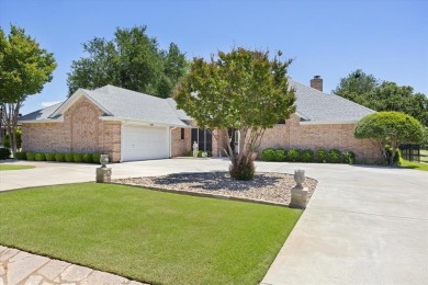 Gorgeous - fantastic drive up appeal and outstanding fairway on Pecan Plantation Country Club in Texas - for sale on GolfHomes.com, golf home, golf lot