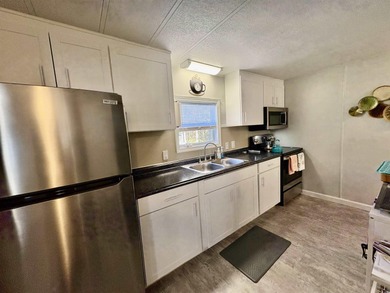 Welcome home to this beautifully updated 2-bedroom, 2-bath on Indigo Creek Golf Club in South Carolina - for sale on GolfHomes.com, golf home, golf lot