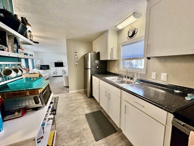 Welcome home to this beautifully updated 2-bedroom, 2-bath on Indigo Creek Golf Club in South Carolina - for sale on GolfHomes.com, golf home, golf lot