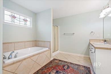 You'll fall in love with this Creole cottage-style home nestled on Isle Dauphine Club Golf Course in Alabama - for sale on GolfHomes.com, golf home, golf lot