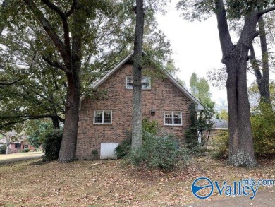 Two story brick home adjacent to Twin Lake golf course and pond on Twin Lakes Golf Course in Alabama - for sale on GolfHomes.com, golf home, golf lot