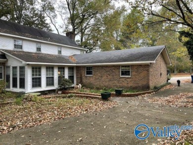 Two story brick home adjacent to Twin Lake golf course and pond on Twin Lakes Golf Course in Alabama - for sale on GolfHomes.com, golf home, golf lot