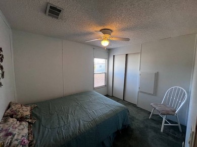 This 940 sq ft home offers an open floor plan and a bright on Lake Henry Golf Club in Florida - for sale on GolfHomes.com, golf home, golf lot