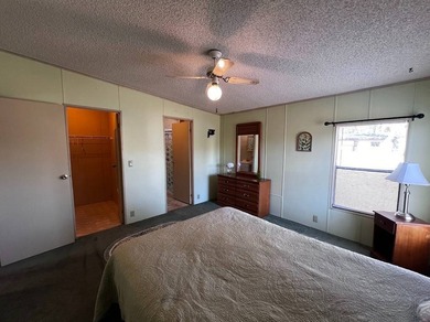 This 940 sq ft home offers an open floor plan and a bright on Lake Henry Golf Club in Florida - for sale on GolfHomes.com, golf home, golf lot