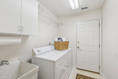 This custom-built home in the sought-after Woodlake section of on Eagle Harbor Golf Club in Florida - for sale on GolfHomes.com, golf home, golf lot