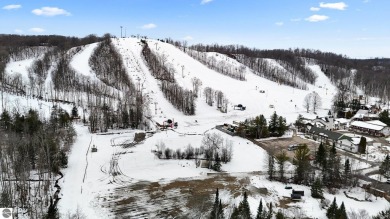 This delightful condo at Schuss Mountain Village in Shanty Creek on Schuss Mountain Golf Club in Michigan - for sale on GolfHomes.com, golf home, golf lot