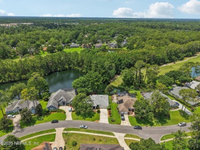 This custom-built home in the sought-after Woodlake section of on Eagle Harbor Golf Club in Florida - for sale on GolfHomes.com, golf home, golf lot