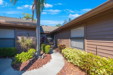 Beautifully UPDATED TURNKEY end unit villa with lots of natural on Palm Aire Country Club of Sarasota in Florida - for sale on GolfHomes.com, golf home, golf lot