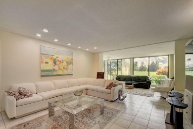 Beautifully maintained 3-bedroom, 3-bath corner unit on the golf on Fountains Golf and Country Club in Florida - for sale on GolfHomes.com, golf home, golf lot