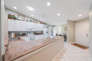 Beautifully UPDATED TURNKEY end unit villa with lots of natural on Palm Aire Country Club of Sarasota in Florida - for sale on GolfHomes.com, golf home, golf lot