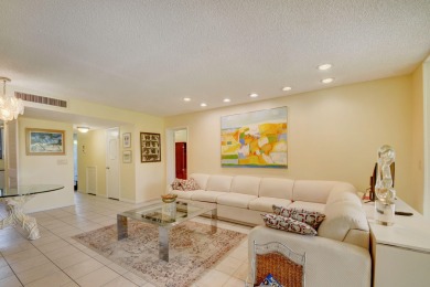 Beautifully maintained 3-bedroom, 3-bath corner unit on the golf on Fountains Golf and Country Club in Florida - for sale on GolfHomes.com, golf home, golf lot