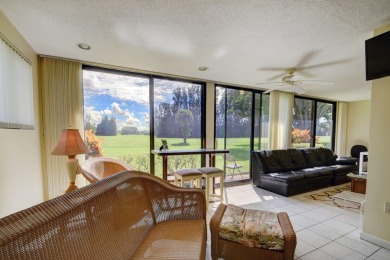 Beautifully maintained 3-bedroom, 3-bath corner unit on the golf on Fountains Golf and Country Club in Florida - for sale on GolfHomes.com, golf home, golf lot