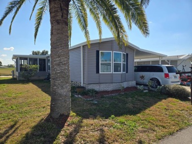 You don't want to miss this fully furnished 2/2 home in Hidden on Lake Henry Golf Club in Florida - for sale on GolfHomes.com, golf home, golf lot