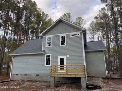Welcome to your dream home, a stunning new construction by local on Woodlake Country Club in North Carolina - for sale on GolfHomes.com, golf home, golf lot