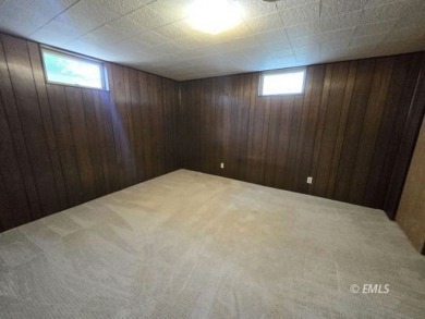 Nestled in the Country Club Estates, this charming ranch-style on Miles City Town and Country Club in Montana - for sale on GolfHomes.com, golf home, golf lot